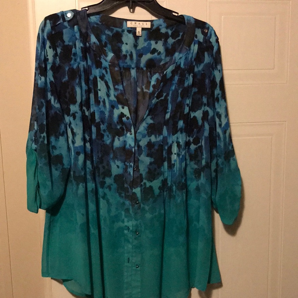 Cute green turquoise blouse w\a splash of  blue and black %100 polyester casual.